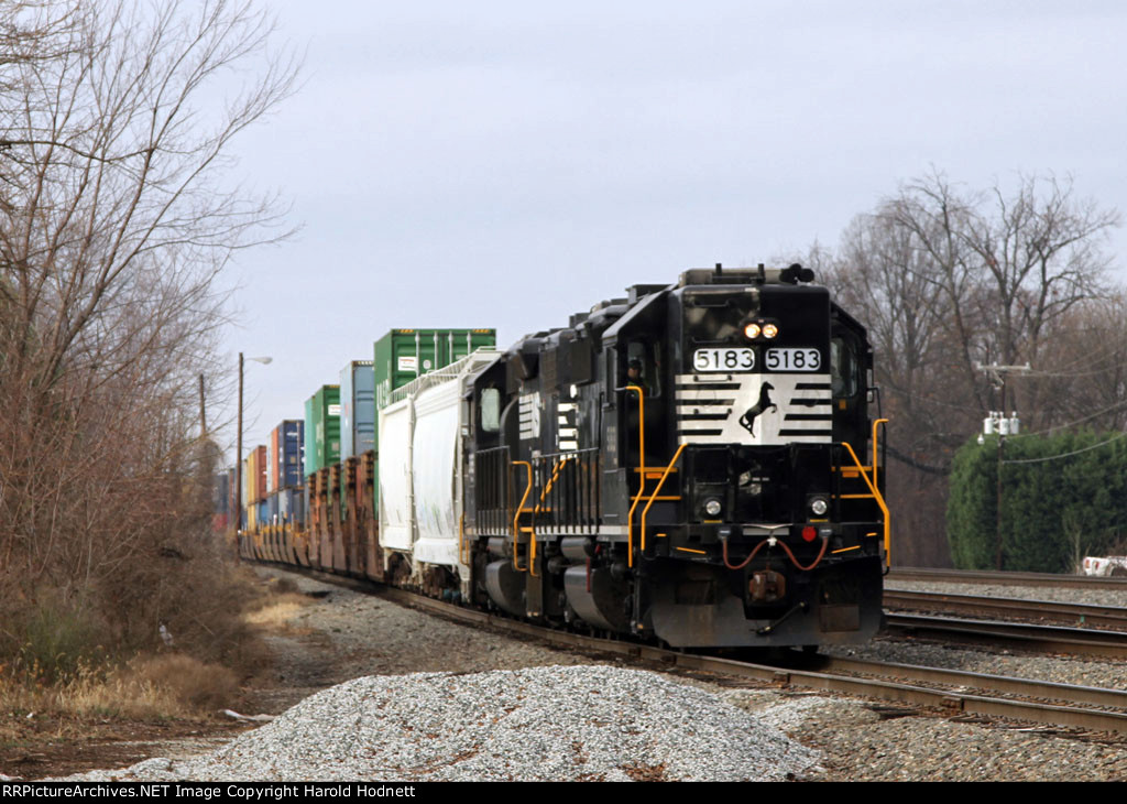 NS 5183 leads the A&Y job down the lead with stack cars in tow